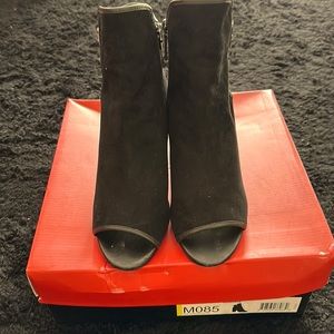 Donald J Pliner clack suede peep toe booties.  Worn to try on for fit and look.